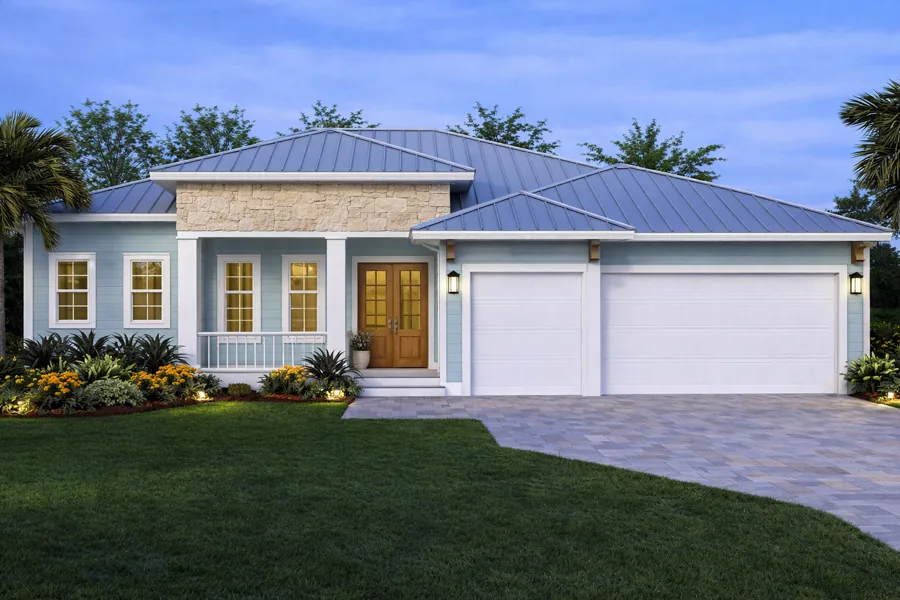 Coastal Collection home at dusk with a standing-seam metal roof and three-car garage