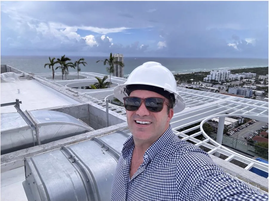 James J. Cloud in a hard hat on the roof of a coastal construction project in South Florida